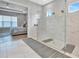 Elegant bathroom featuring a large walk-in shower and access to bedroom at 15415 Derna Ter, Bradenton, FL 34211