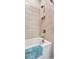 Bathroom with built-in shower and tile surround at 15415 Derna Ter, Bradenton, FL 34211