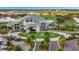 Aerial view of community clubhouse entrance with circular driveway and landscaping at 15415 Derna Ter, Bradenton, FL 34211