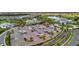 An aerial view of the community's parking lot adjacent to the clubhouse at 15415 Derna Ter, Bradenton, FL 34211