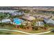 Aerial view of community pool, bocce ball courts, and other amenities at 15415 Derna Ter, Bradenton, FL 34211