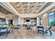 Bright and airy community room with tables and chairs for gatherings at 15415 Derna Ter, Bradenton, FL 34211