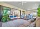 Relaxing covered patio with comfortable seating and view of kitchen at 15415 Derna Ter, Bradenton, FL 34211