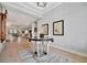 Elegant entryway with hardwood floors, artwork and a view to the living room at 15415 Derna Ter, Bradenton, FL 34211