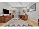 Bright home office features hardwood floors, built-in cabinetry, and a large desk at 15415 Derna Ter, Bradenton, FL 34211