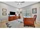 Spacious home office with hardwood floors, large desk, and built-in cabinetry at 15415 Derna Ter, Bradenton, FL 34211