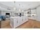 Modern kitchen with white cabinets and a large island at 15415 Derna Ter, Bradenton, FL 34211
