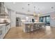 Gourmet kitchen featuring white cabinets and stainless steel appliances at 15415 Derna Ter, Bradenton, FL 34211