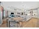 Open concept kitchen with island and breakfast bar, flows into living area at 15415 Derna Ter, Bradenton, FL 34211
