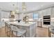 Modern kitchen with white cabinets and large island at 15415 Derna Ter, Bradenton, FL 34211