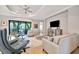 Relaxing living room with comfortable seating and large TV at 15415 Derna Ter, Bradenton, FL 34211
