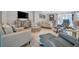 Spacious living room with comfy seating and a large TV at 15415 Derna Ter, Bradenton, FL 34211