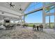 Spacious outdoor lounge with comfortable seating and a golf course view at 15415 Derna Ter, Bradenton, FL 34211