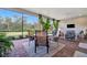 Enjoy this screened patio with comfortable seating and a view of the backyard at 15415 Derna Ter, Bradenton, FL 34211