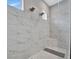 Large walk-in shower with double shower heads and built-in bench at 15415 Derna Ter, Bradenton, FL 34211