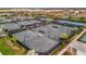 Well-maintained tennis courts with shaded seating areas at 15415 Derna Ter, Bradenton, FL 34211