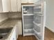 Bright kitchen features white cabinets and granite countertops at 1630 29Th St, Sarasota, FL 34234