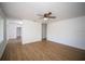 Large living room with wood floors and multiple entrances at 1630 29Th St, Sarasota, FL 34234