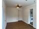 Spacious living room with light wood floors and ceiling fan at 1630 29Th St, Sarasota, FL 34234