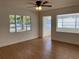 Living room featuring wood floors and a ceiling fan at 1630 29Th St, Sarasota, FL 34234