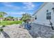 Backyard patio with Adirondack chairs and a fire pit, offering a cozy outdoor gathering space at 2287 Bayshore Rd, Nokomis, FL 34275