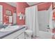Bathroom with tub shower and updated vanity at 2771 Golf Course Dr # 101, Sarasota, FL 34234
