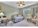 Cozy bedroom featuring a daybed and sitting area at 2771 Golf Course Dr # 101, Sarasota, FL 34234