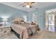 Bright bedroom with a queen-size bed and ensuite access at 2771 Golf Course Dr # 101, Sarasota, FL 34234
