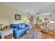 Bright living room with light walls and hardwood floors at 2771 Golf Course Dr # 101, Sarasota, FL 34234