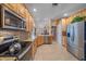 Kitchen with stainless steel appliances and light wood cabinets at 4327 Marcott Cir, Sarasota, FL 34233