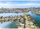 Aerial view of waterfront property with a pool and canal access at 445 115Th Ave, Treasure Island, FL 33706