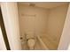 Clean bathroom with a bathtub, toilet, and tiled walls at 4604 Longwater # 77, Sarasota, FL 34235