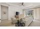 Living area with white sofa and large window overlooking backyard at 4708 Trento Pl, Bradenton, FL 34211