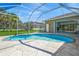 Relaxing kidney-shaped pool with screened enclosure at 4931 Flagstone Dr, Sarasota, FL 34238