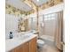 Bathroom with shower and beach themed shower curtain and accents at 518 Luminary Blvd, Osprey, FL 34229