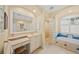 Bathroom featuring a vanity, separate makeup vanity, glass block shower at 518 Luminary Blvd, Osprey, FL 34229