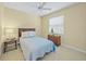 Bedroom with bed, side table, and window at 518 Luminary Blvd, Osprey, FL 34229