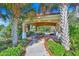 Inviting outdoor pavilion with covered seating area, perfect for gatherings amidst beautiful landscaping at 518 Luminary Blvd, Osprey, FL 34229