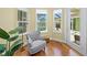 Sitting area with chair, hardwood floors, and view of the pool at 518 Luminary Blvd, Osprey, FL 34229