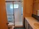 Updated bathroom with a walk-in shower and tiled floors at 5504 Bermuda Ct, Bradenton, FL 34207
