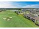 Aerial view of community with golf course and homes at 6055 Worsham Ln # 104, Lakewood Ranch, FL 34211