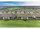 Community overview with golf course and lake views at 6055 Worsham Ln # 104, Lakewood Ranch, FL 34211