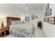Bright bedroom with a queen-size bed and en-suite bathroom at 6055 Worsham Ln # 104, Lakewood Ranch, FL 34211