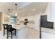 Modern kitchen with white cabinets, granite counters, and stainless steel appliances at 6055 Worsham Ln # 104, Lakewood Ranch, FL 34211