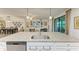 Island kitchen with granite countertops and stainless steel appliances at 6055 Worsham Ln # 104, Lakewood Ranch, FL 34211