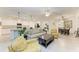 Open floor plan boasting a spacious kitchen with island and adjacent living area at 6055 Worsham Ln # 104, Lakewood Ranch, FL 34211