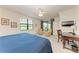 Main bedroom features a king-size bed and a private sitting area at 6055 Worsham Ln # 104, Lakewood Ranch, FL 34211