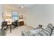 Home office with desk, chair, and comfortable sofa at 6055 Worsham Ln # 104, Lakewood Ranch, FL 34211