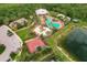 Aerial view of community amenities including pool, playground, basketball court, and other recreational areas at 6318 Anise Dr, Sarasota, FL 34238