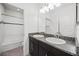Bathroom featuring a double sink vanity with granite countertop and tiled shower/tub combo at 6318 Anise Dr, Sarasota, FL 34238